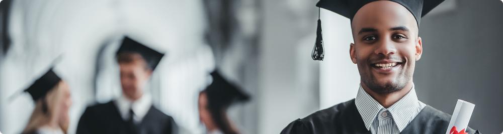 young man in graduation cap needs to build credit